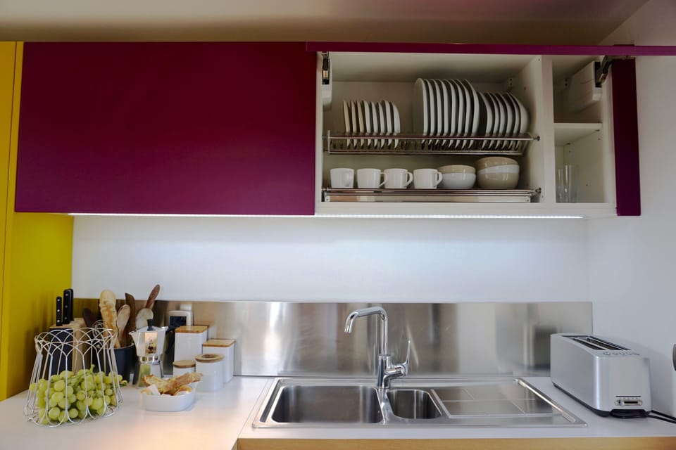 The cupboards are well stocked with tableware
