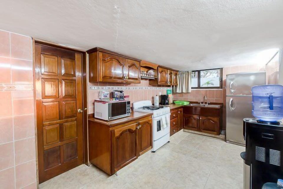 The kitchen is fully equipped with standard appliances