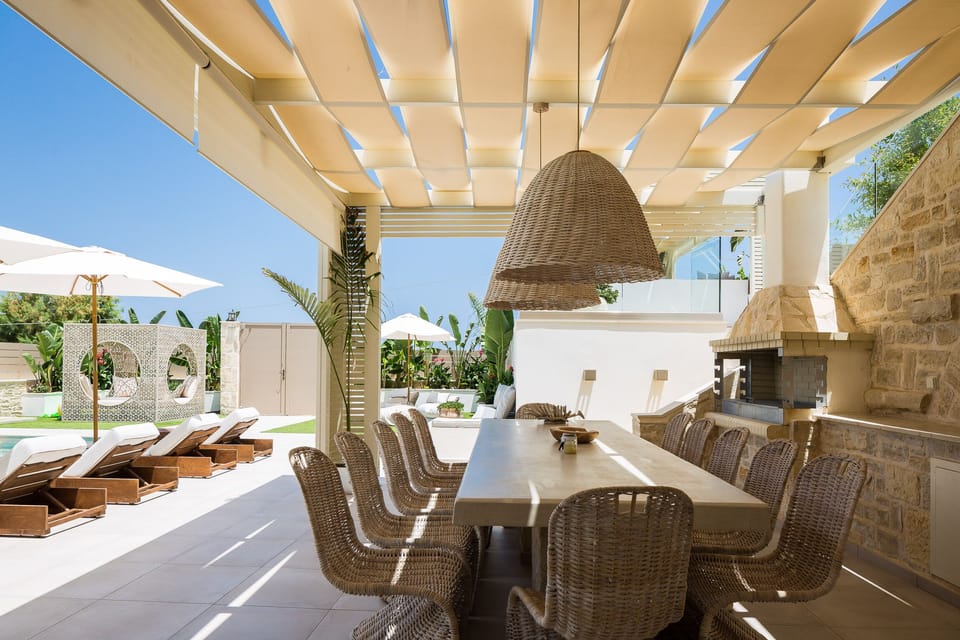 Outdoor dining area, next to the barbecue.