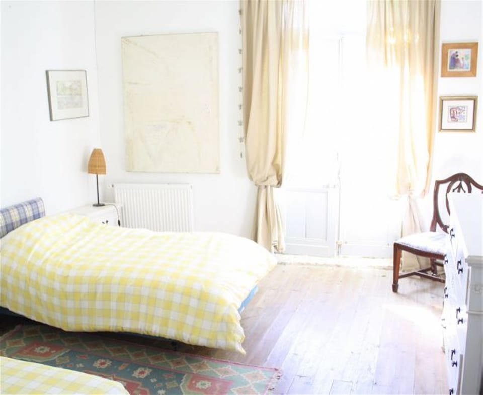 Bedroom 1.  2 singles or double. French windows.