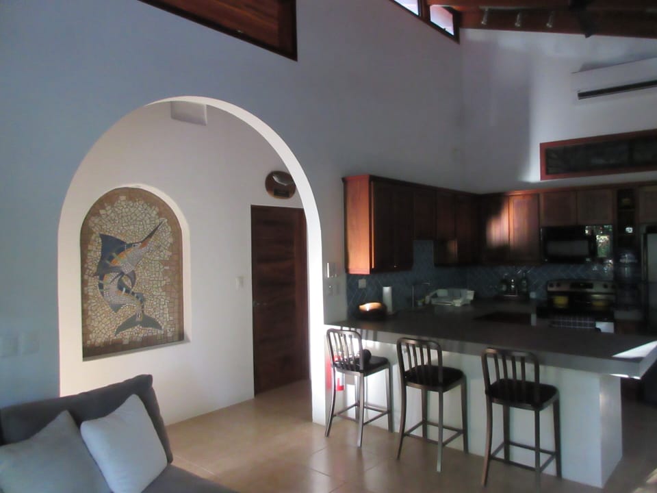Breakfast bar and local artisan mosaic of a blue marlin.