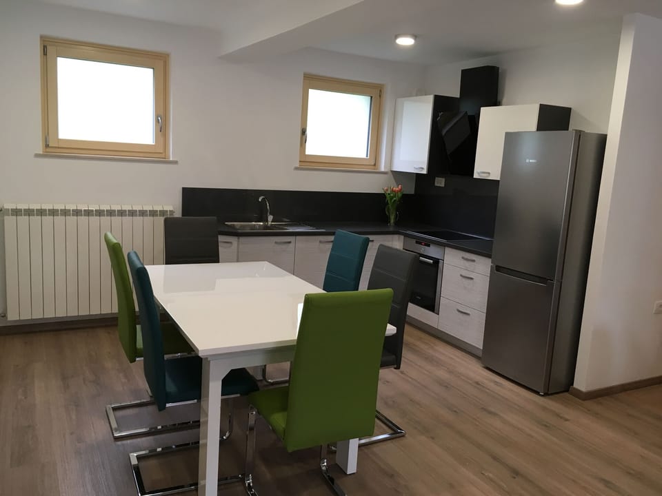 Spacious kitchen with dining table