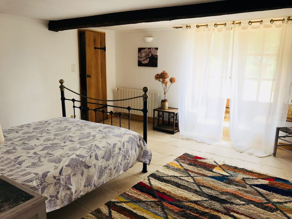 The master suite with doors to garden 