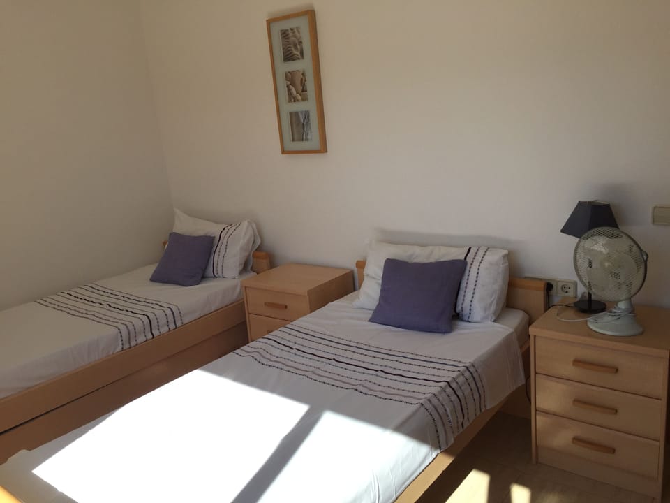 Twin room with sunny morning outlook across the valley