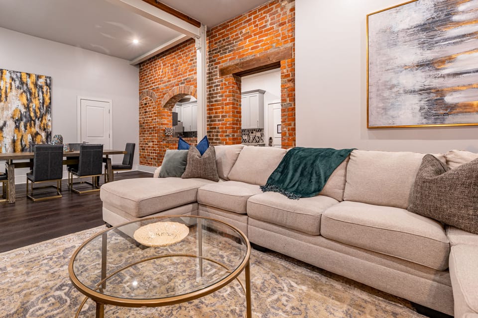 Open concept living and dining area with comfortable seating for you and your guests. 55" Samsung Smart 4K TV for streaming from apps, along with the DIRECTV Entertainment. Lounge on the extra-large sectional after an activity filled day in NOLA!