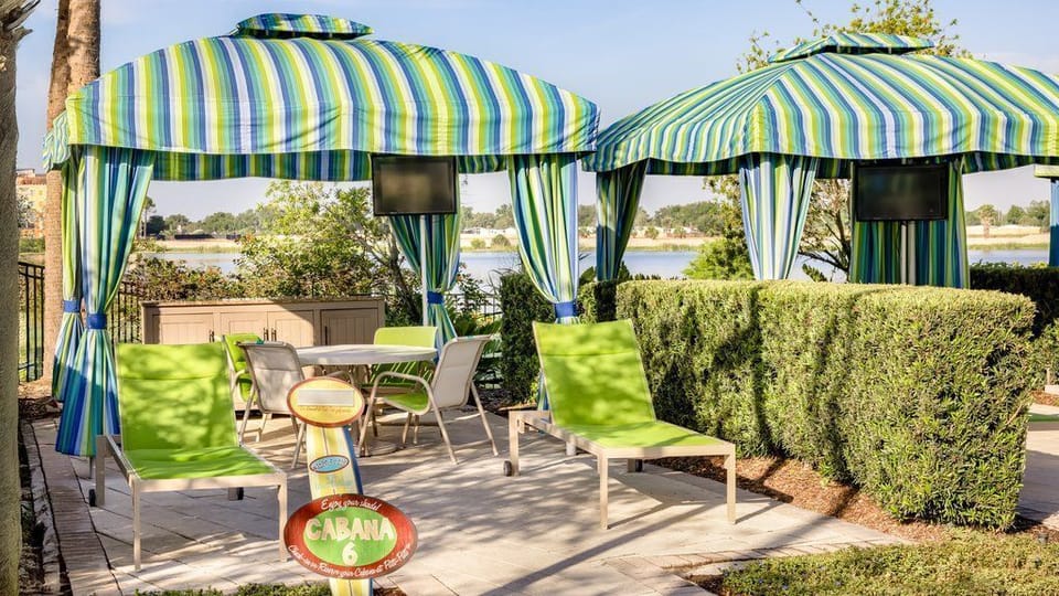 Relax in style at your private cabana, complete with lounge chairs and a table for gathering.