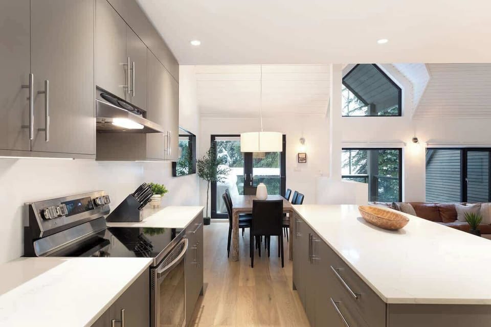 - Modern kitchen design with full stainless-steel appliances and bright lighting  
- Open flow connects kitchen to dining and living for easy entertaining  
- Spacious countertops perfect for prepping and hosting mountain meals  