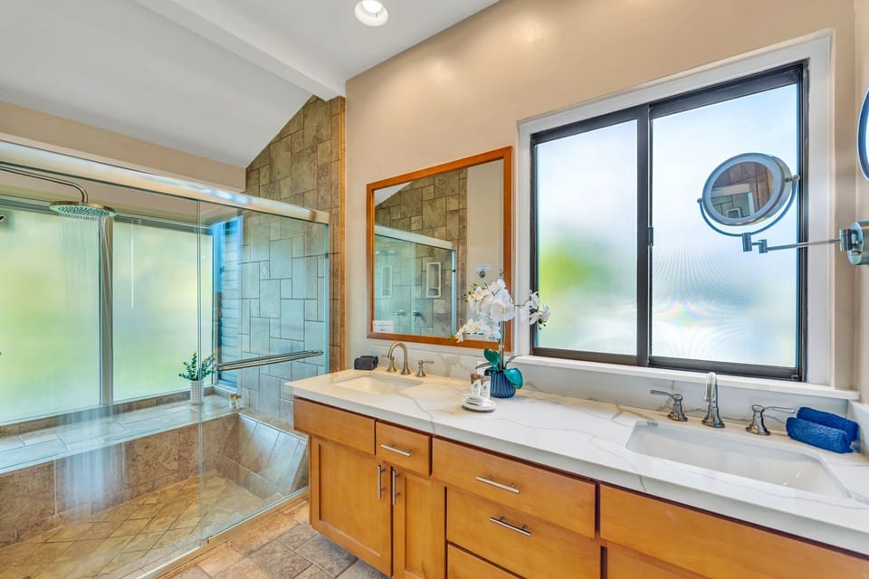 Double sinks and lots of cabinets and countertop space