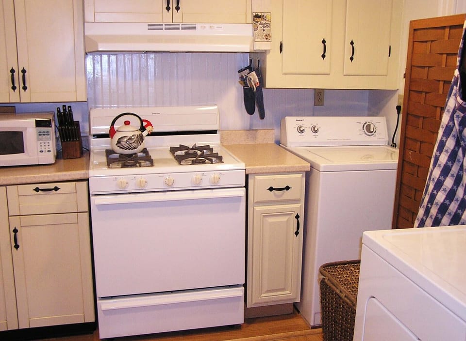 View of Gas Range and Washing Machine