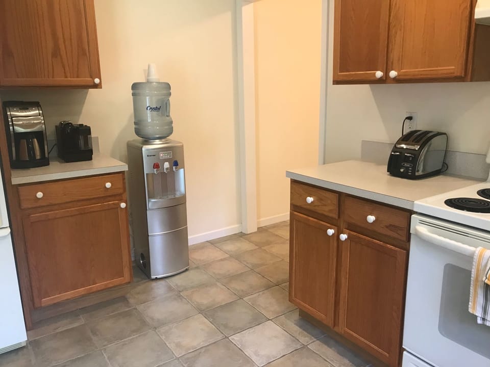 Kitchen with water cooler and ice maker