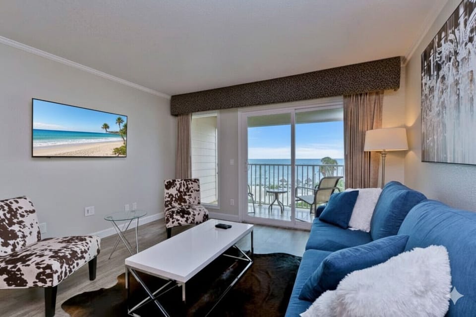 Living Room Retreat: Enjoy ocean views and stylish decor from your beachfront escape!
