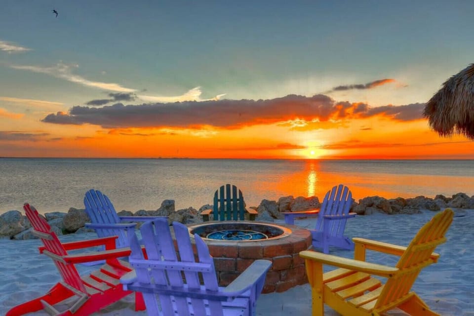 Firepit Paradise: Gather around vibrant chairs and toast marshmallows as sunsets paint the sky!