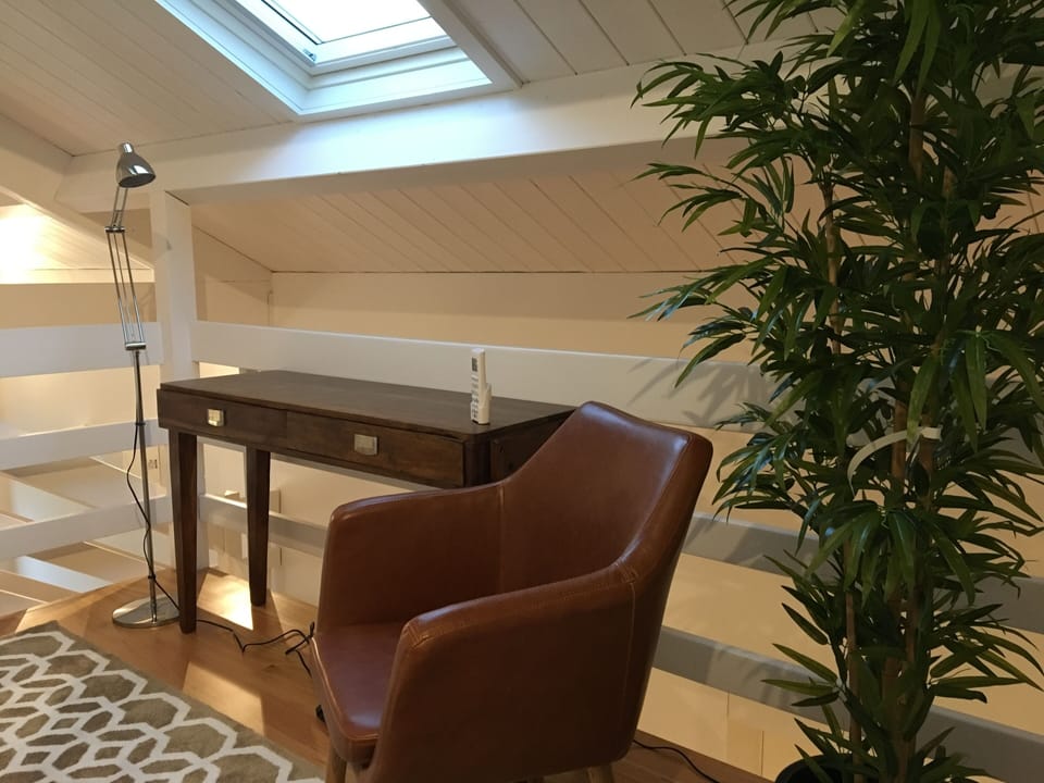 Mezzanine level - comfortable chair and writing desk for work or relaxing. 