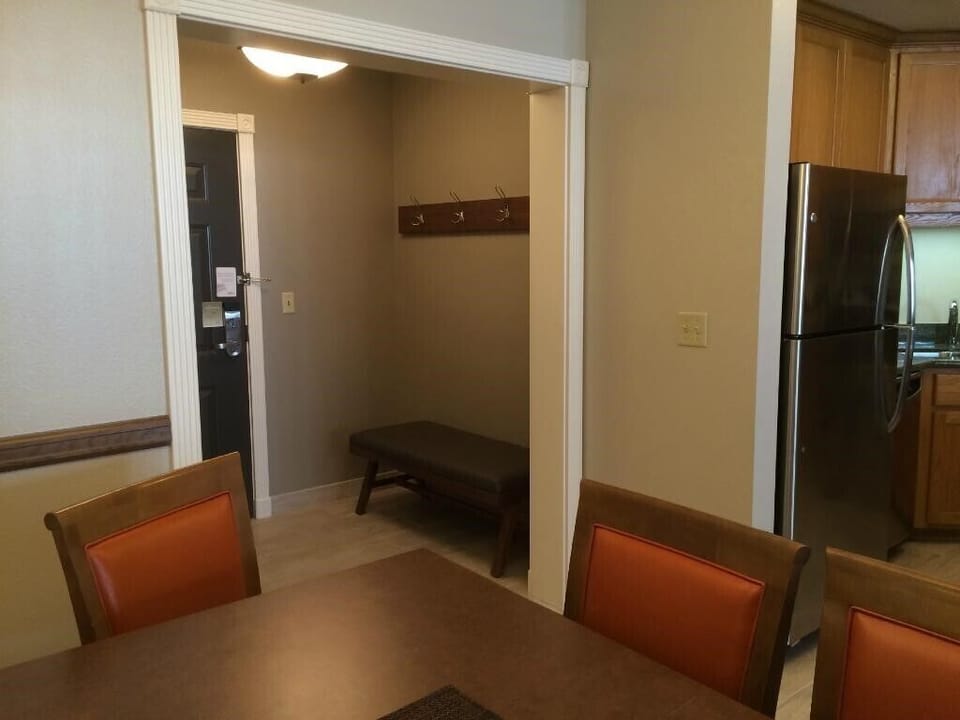Entry with bench to take off ski boots, and coat hooks on the wall above