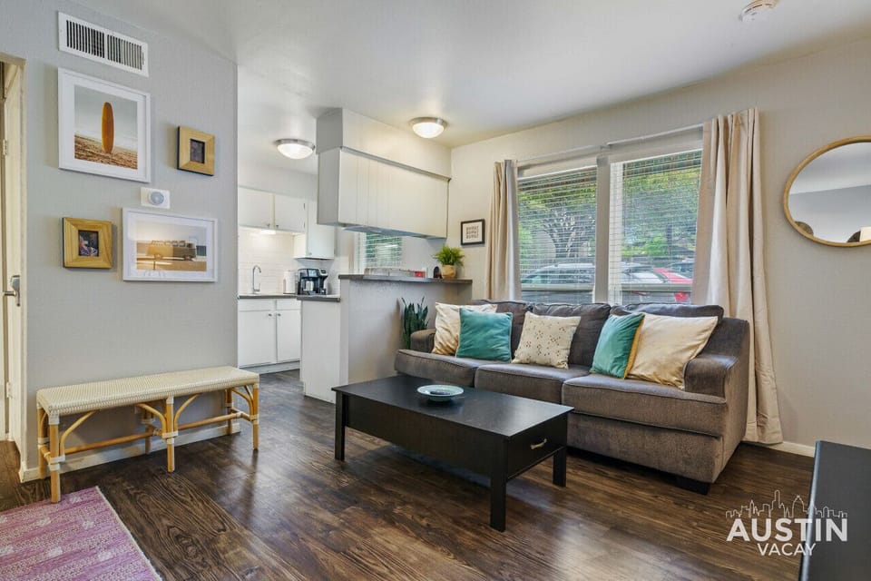 Living area with sleeper sofa and coffee table that flips up so you can work or eat here