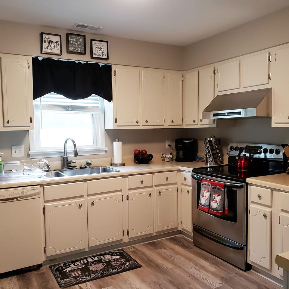 Kitchen - has spices, coffee, cold mugs for.... and numbers for local carry out!