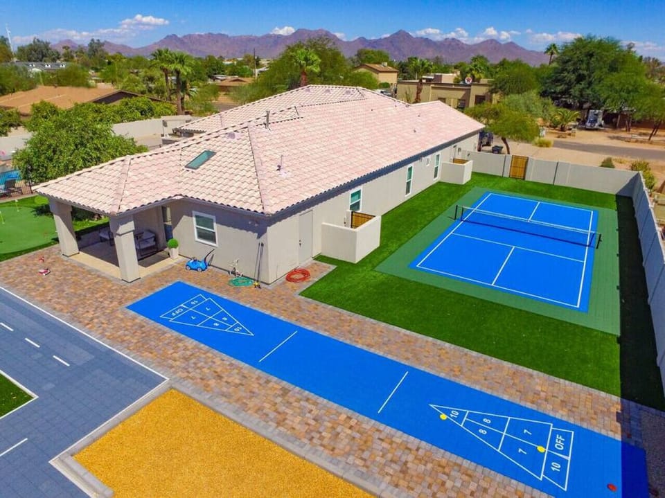 [Backyard] with a pickleball court and shuffleboard
