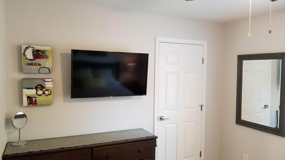 Bedroom and door to walk in closet with washer and dryer