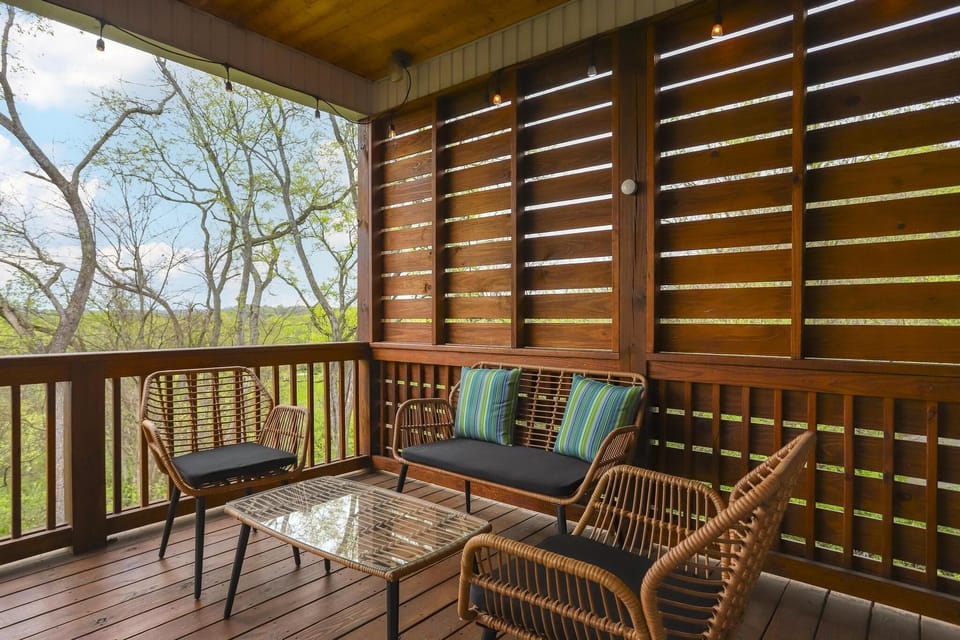 A place for coffee or a glass of wine on the larger upper deck.