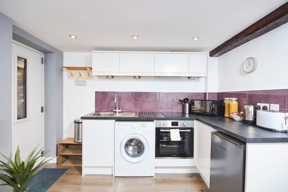 Fully-equipped kitchen with all crockery, pots, pans and utensils provided. Ample storage space and washing facilities