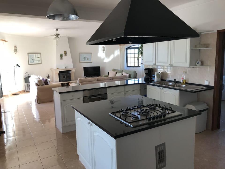 Spacious kitchen with granite work surfaces