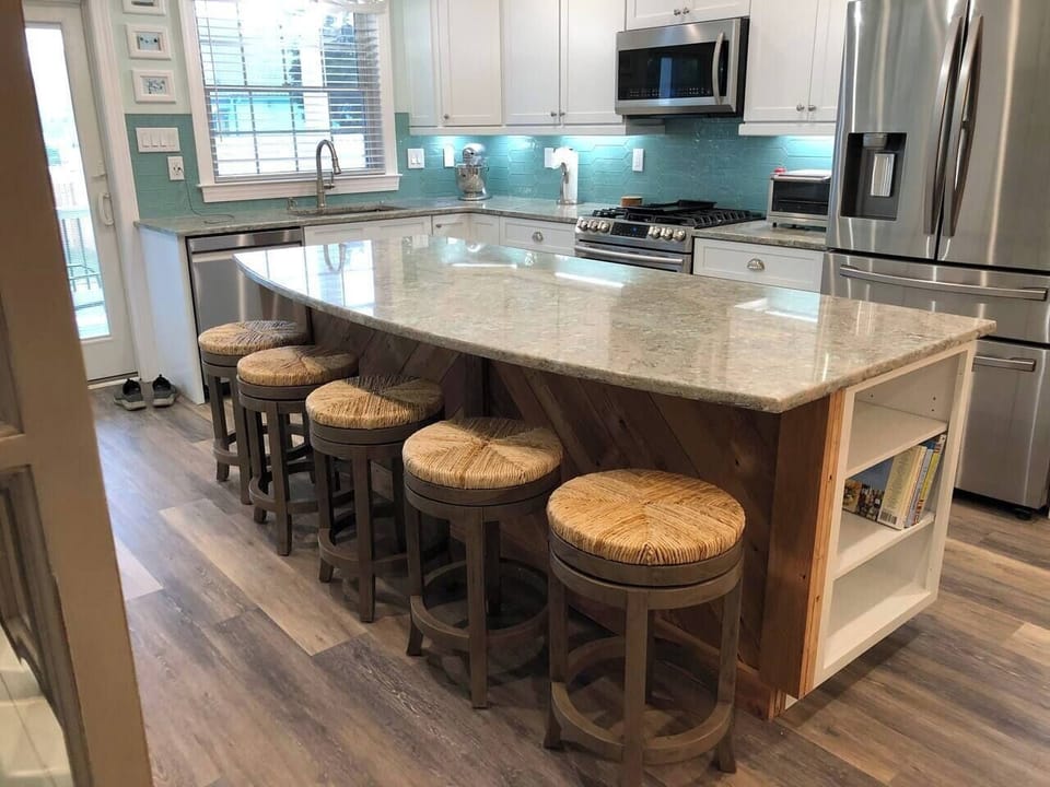 View of the kitchen island which is backed with wood from the original house