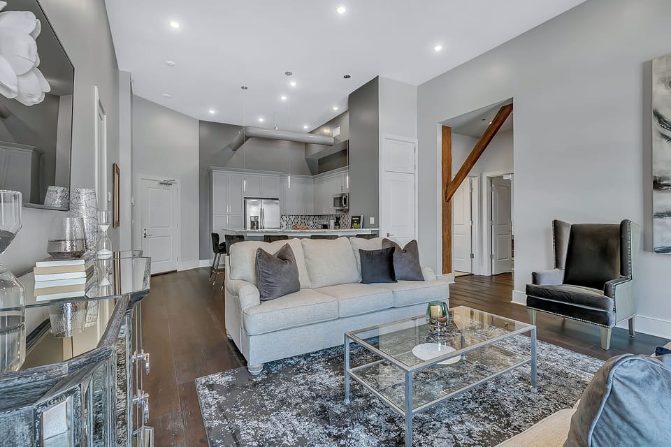 Open-concept living, kitchen, dining area with ample seating for you and your guests. 65” Samsung Smart 4K TV with streaming and DIRECTV Entertainment. The sofa converts to a queen-size sleeper! Dining table seats two. Enjoy plenty of natural light!