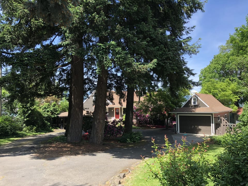 Front-of-house circle driveway with covered parking.  Yard space for play!