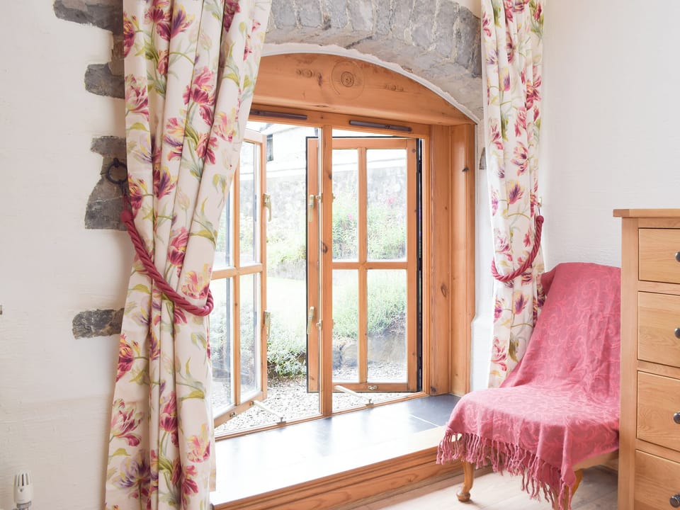 Pretty bedroom with delightful furnishings | The Byre - Lyserry Barns, Bosherston, near Pembroke