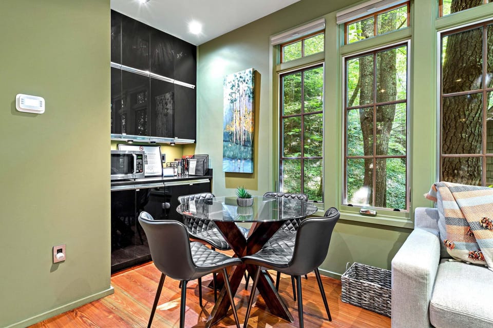 Dining table for 4 and alcove with microwave.