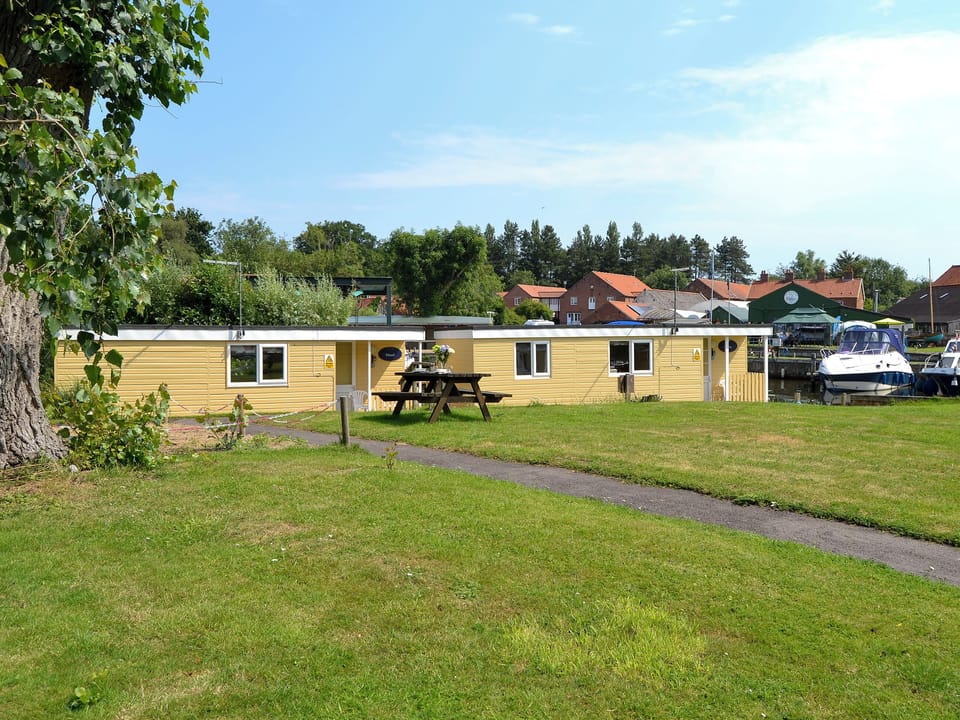 Wonderful houseboats moored alongside the River Ant | Ardea - Norfolk Riverside Cottages, Stalham