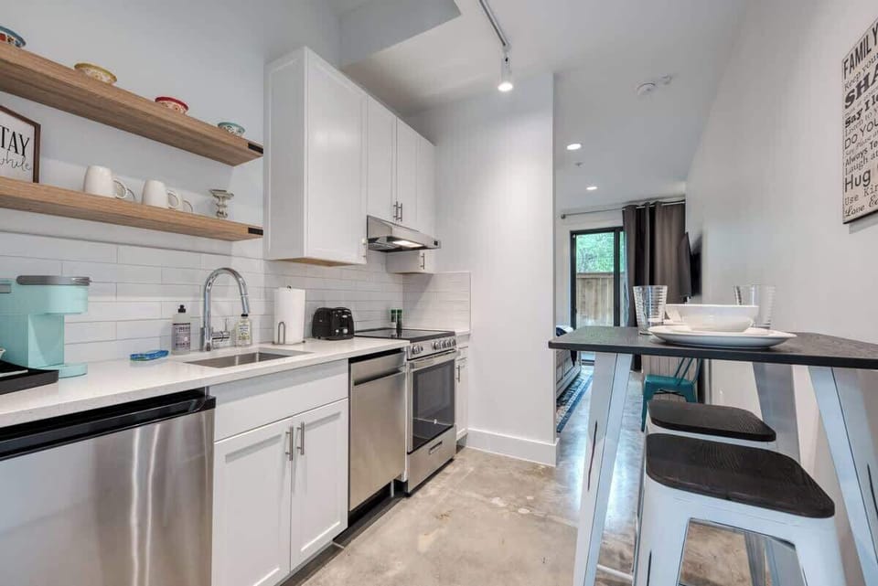 1st Floor Kitchenette with dishwasher, refrigerator, stove top, and Keurig