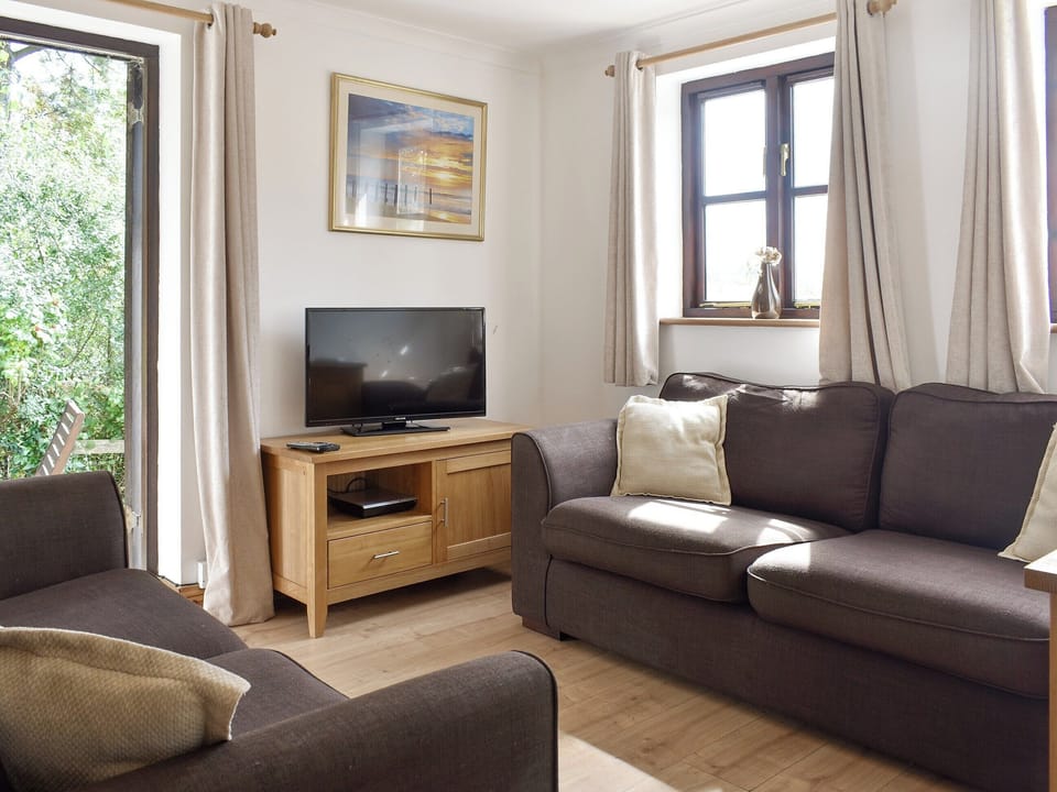 Welcoming living and dining room | Prince Croft Cottage - Mount Hawke Holiday Bungalows, Mount Hawke, near Redruth