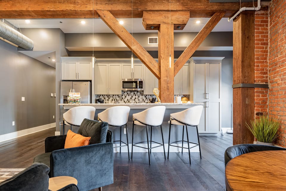 Cook and dine easily in the fully stocked kitchen, equipped with all stainless steel appliances, gas range, basic cookware, and a dining area for a comfortable meal at home. Entertain at the bar with seating for four.