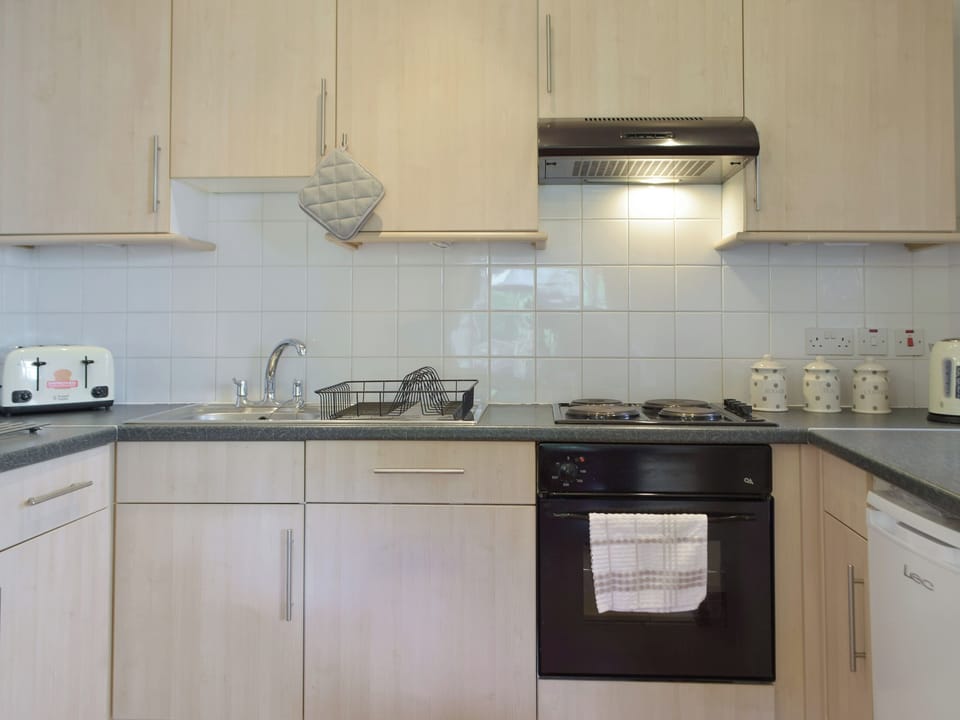 Well-equipped fitted kitchen | Cothi Cottage - Upton Hall Cottages, Nantgaredig, near Llandeilo