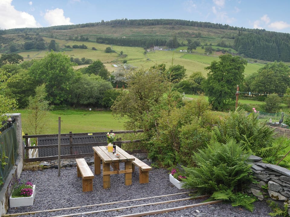 Sitting out area with lovely countryside views | Bwthyn Pabi, Penmachno, near Betws-Y-Coed