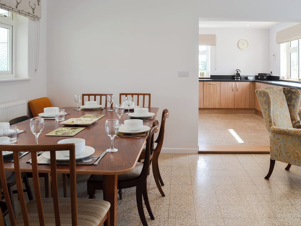 Lovely dining table and chairs and adjacent kitchen | West Middlewick Farm - The Old Creamery - West Middlewick Farm , Nomansland, near Tiverton