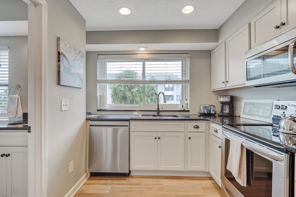 Bright and airy kitchen with all the cooking utensils.