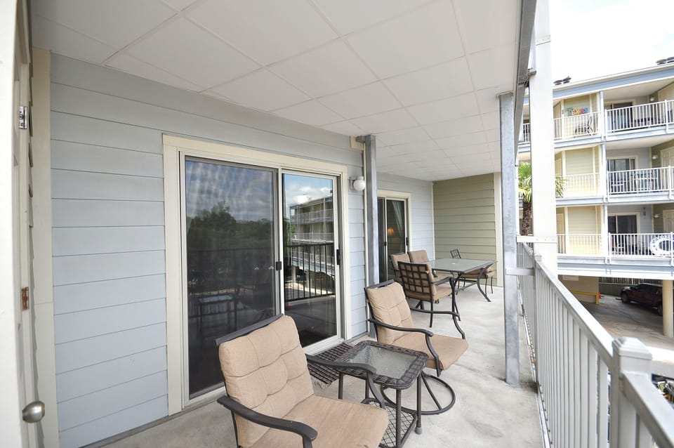 Double balcony with view of pool and river.