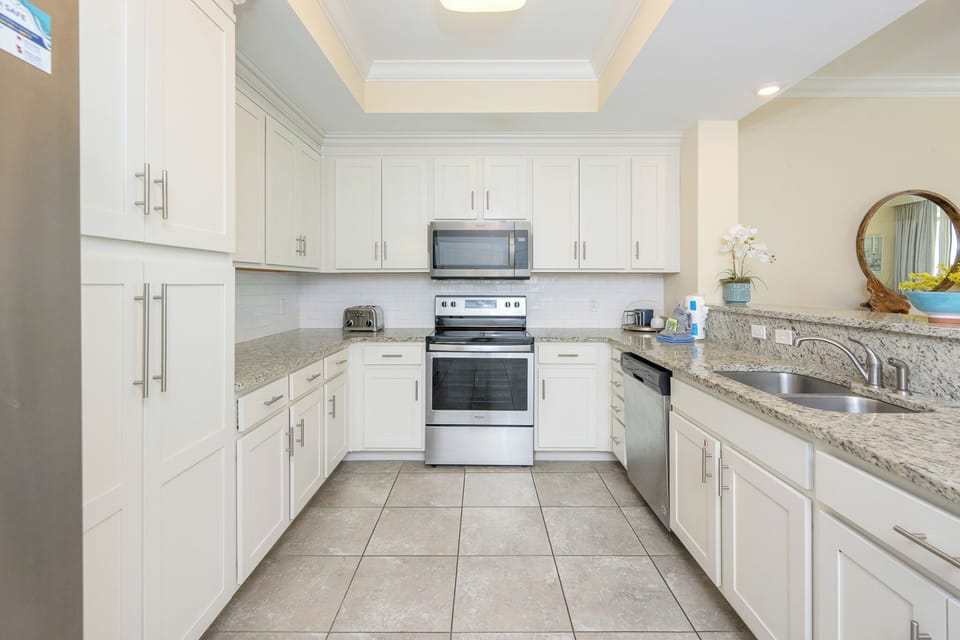 Craft delicious meals in this stylish kitchen with stylish cabinetry and stainless appliances