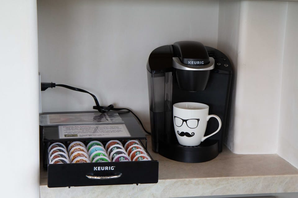 Keurig with abundant coffees not shown here. Also many teas above this nook.