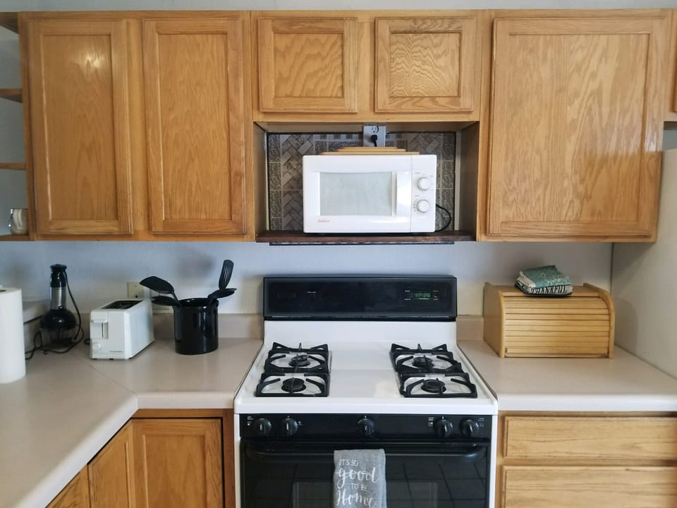 Kitchen with pots and pans coffee maker  and dishes