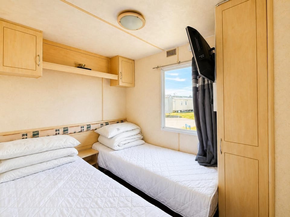 The twin bedroom is perfect for accommodating extra guests during family holidays.