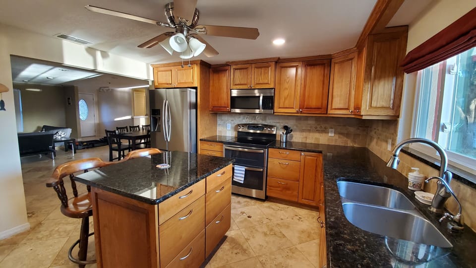 Gourmet kitchen with custom cabinets and granite countertops