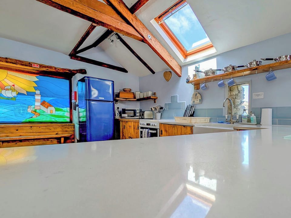 Kitchen in open plan living space and stained glass | New England - Tregrill Farm Cottages, Menheniot, near Liskeard