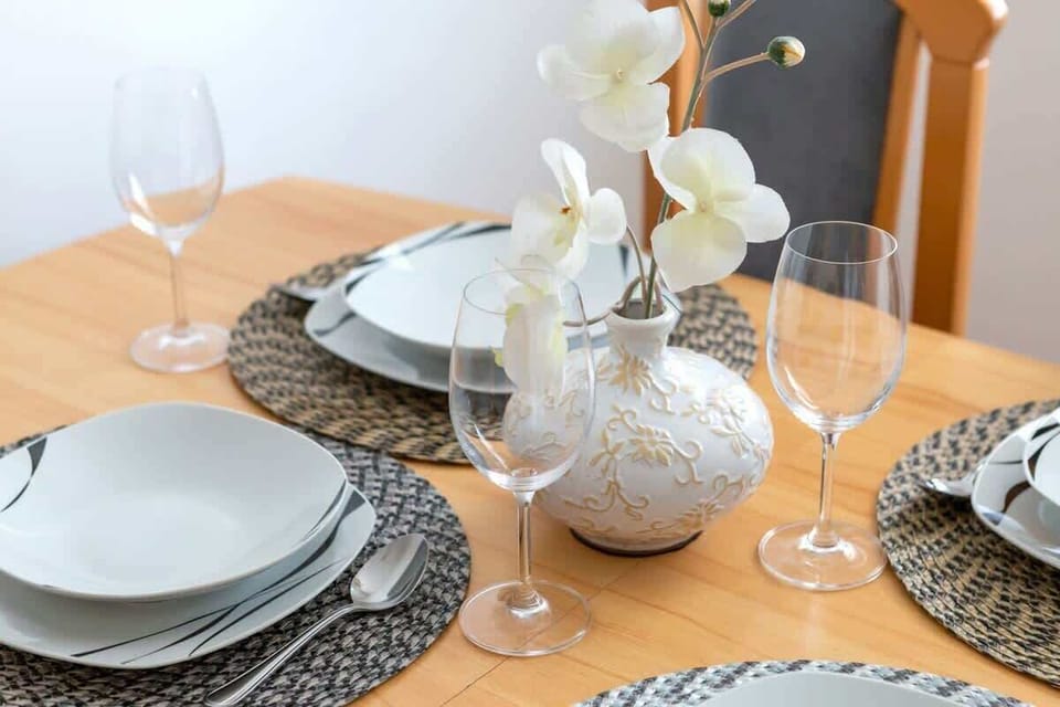 Inviting and functional dining area with table, chairs, and carefully selected decorative details.