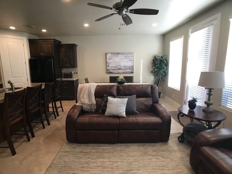 Two couches with electric recliners.