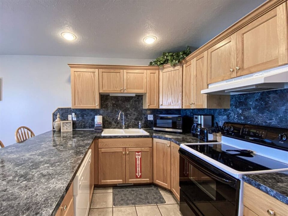 Bright kitchen with ample counter space and appliances