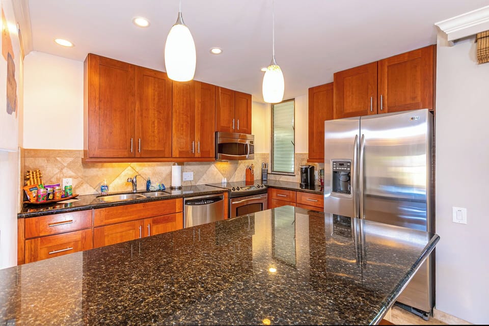 Stainless Steel Appliances with Elegant Wood Cabinetry