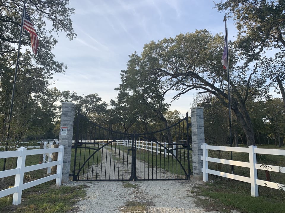 Automatic Main Oasis Ranch Gate with landscaping lights